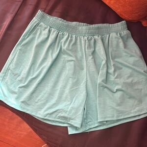 Mint green shorts with pockets.